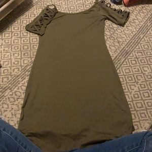 a dark green dress ( crossed sleeves )